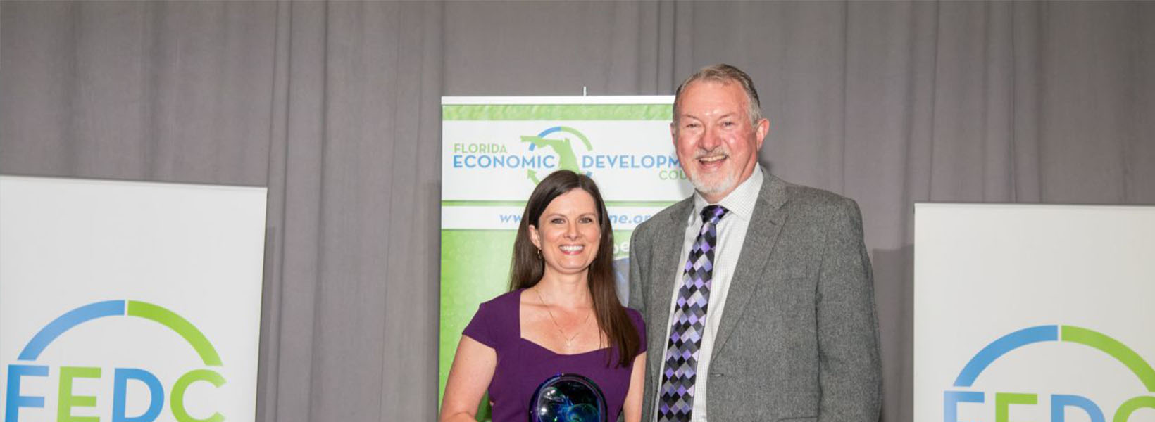 Jimmy Norris and Charissa Setzer pose for award photo