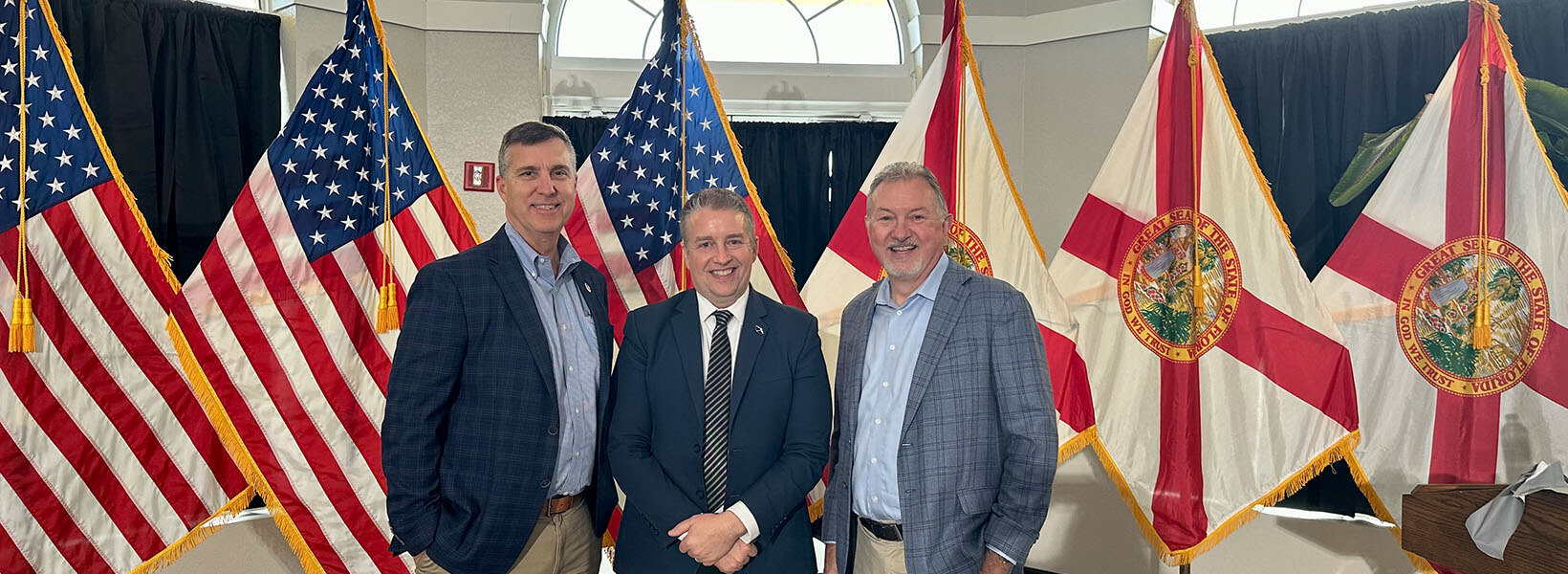 Secretary Alex Kelly poses with County Administrator and Economic Development Director